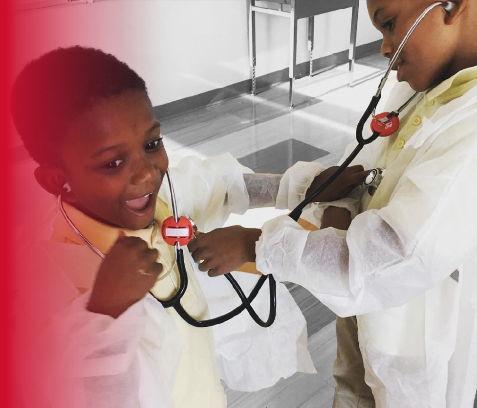 Two kids in an after school program in STEM with Little Medical School.