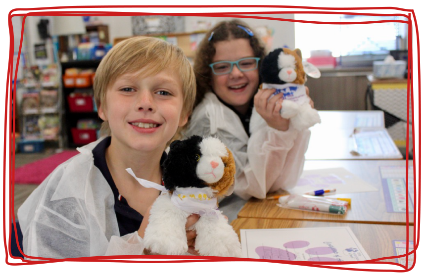 Two kids learning about medicine through a STEM after-school enrichment program by Little Medical School.